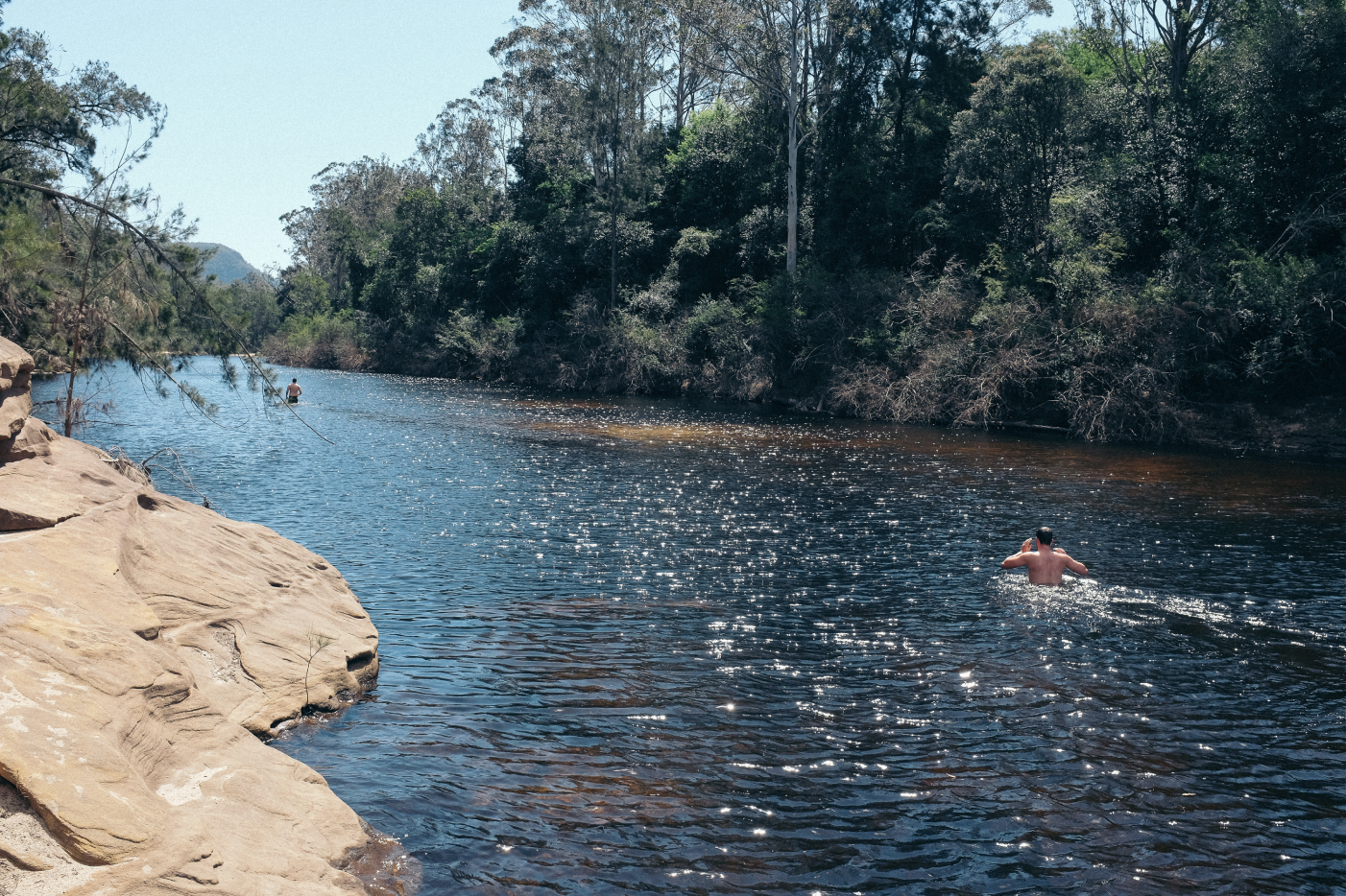 A person swimming in a river